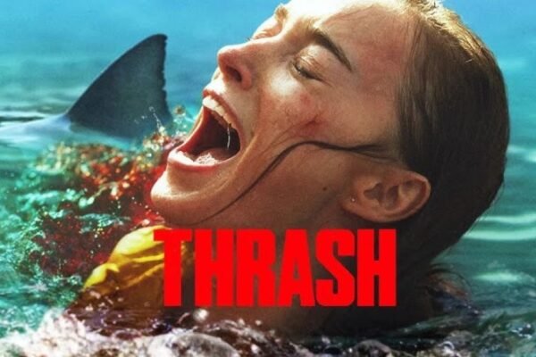 Thrash movie poster featuring a woman screaming in the water with a shark fin behind her